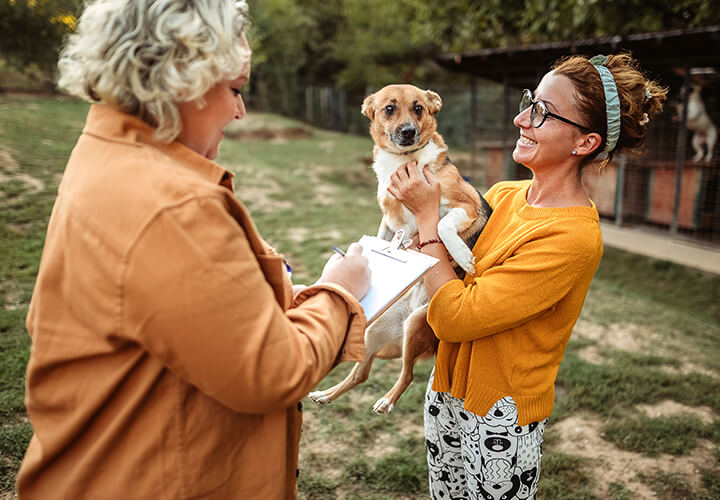 Woman holding dog