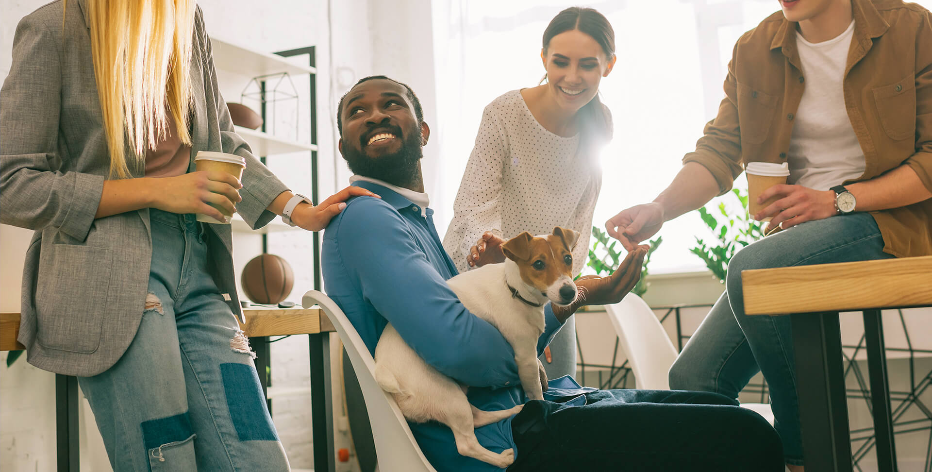 Group of people with man holding dog