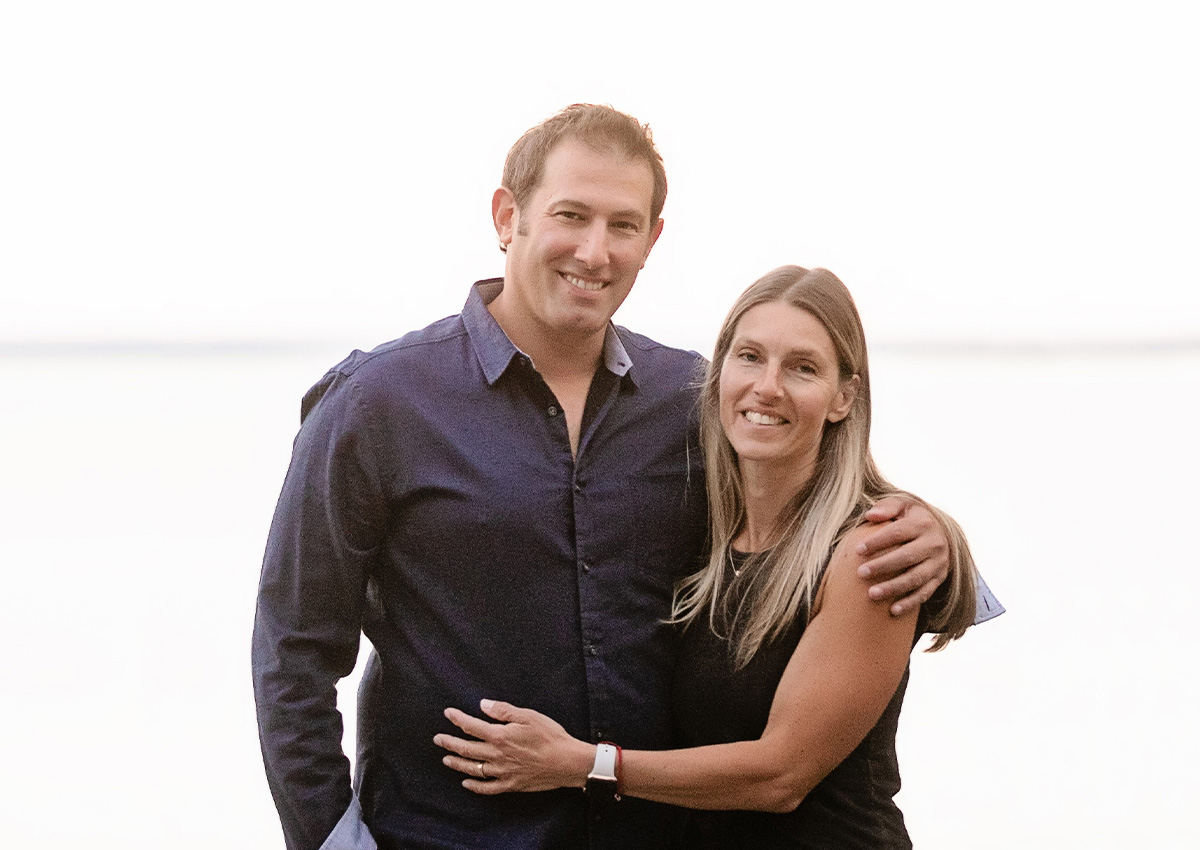 Man and woman posing for photo